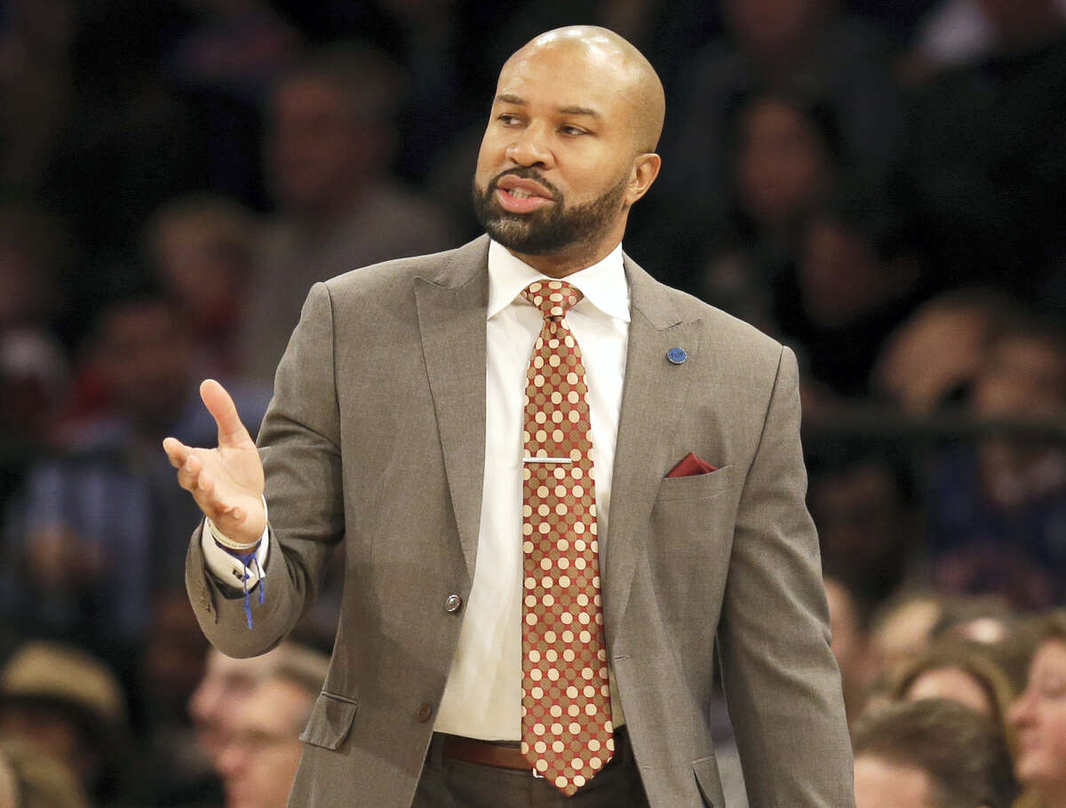 In this file photo, then-New York Knicks head coach Derek Fisher looks on during the first half of the NBA basketball game in New York. A year after being fired, Fisher is back in NBA arenas at the TV table.What he really wants is to be back in the coaching box. ‘ÄúThere’Äôs no question I’Äôll be back at it at some point,’Äù Fisher said.