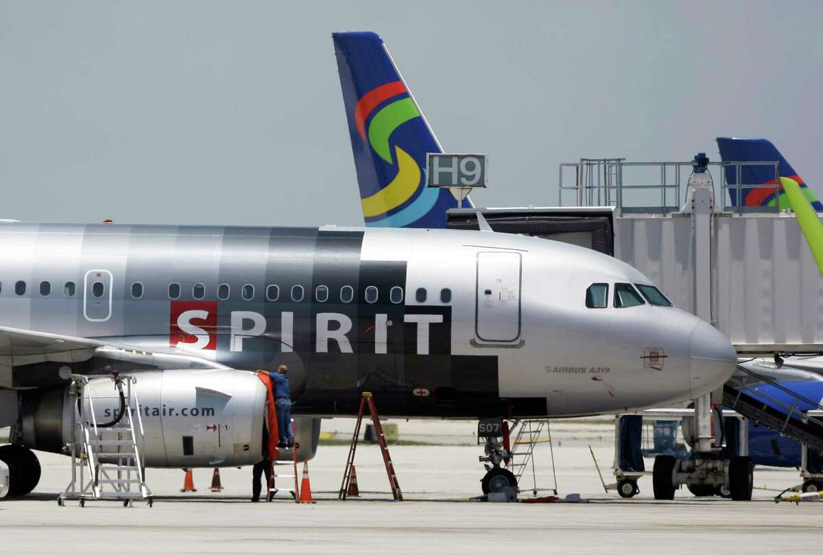 A Spirit Airlines airplane sits on the tarmac at Fort Lauderdale-Hollywood International Airport in Fort Lauderdale, Fla.