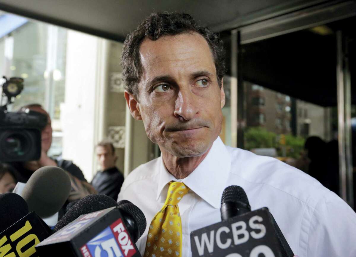 In this July 24, 2013, file photo, former Democratic U.S. Rep. Anthony Weiner leaves his apartment building in New York. Weiner will appear in federal court, Friday, May 19, 2017, to face criminal charges in an investigation of his online communications with a teenage girl in North Carolina.