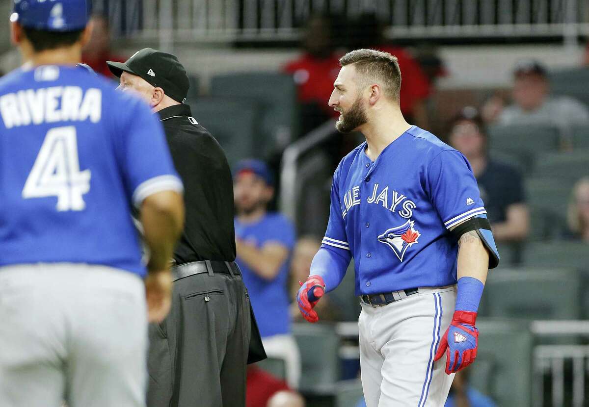 The Blue Jays’ Kevin Pillar looks on as both benches empty onto the field after he exchanged words with Braves relief pitcher Jason Motte.
