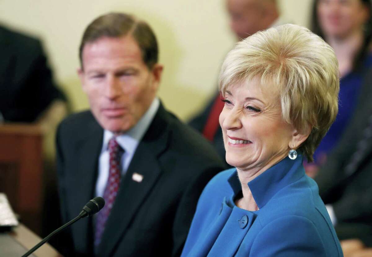 Small Business Administration Administrator-designate, former wrestling entertainment executive, Linda McMahon, accompanied by U.S. Sen. Richard Blumenthal, D-Conn., laughs on Capitol Hill in Washington, Tuesday, Jan. 24, 2017, while testifying at her confirmation hearing before the Senate Small Business and Entrepreneurship Committee.