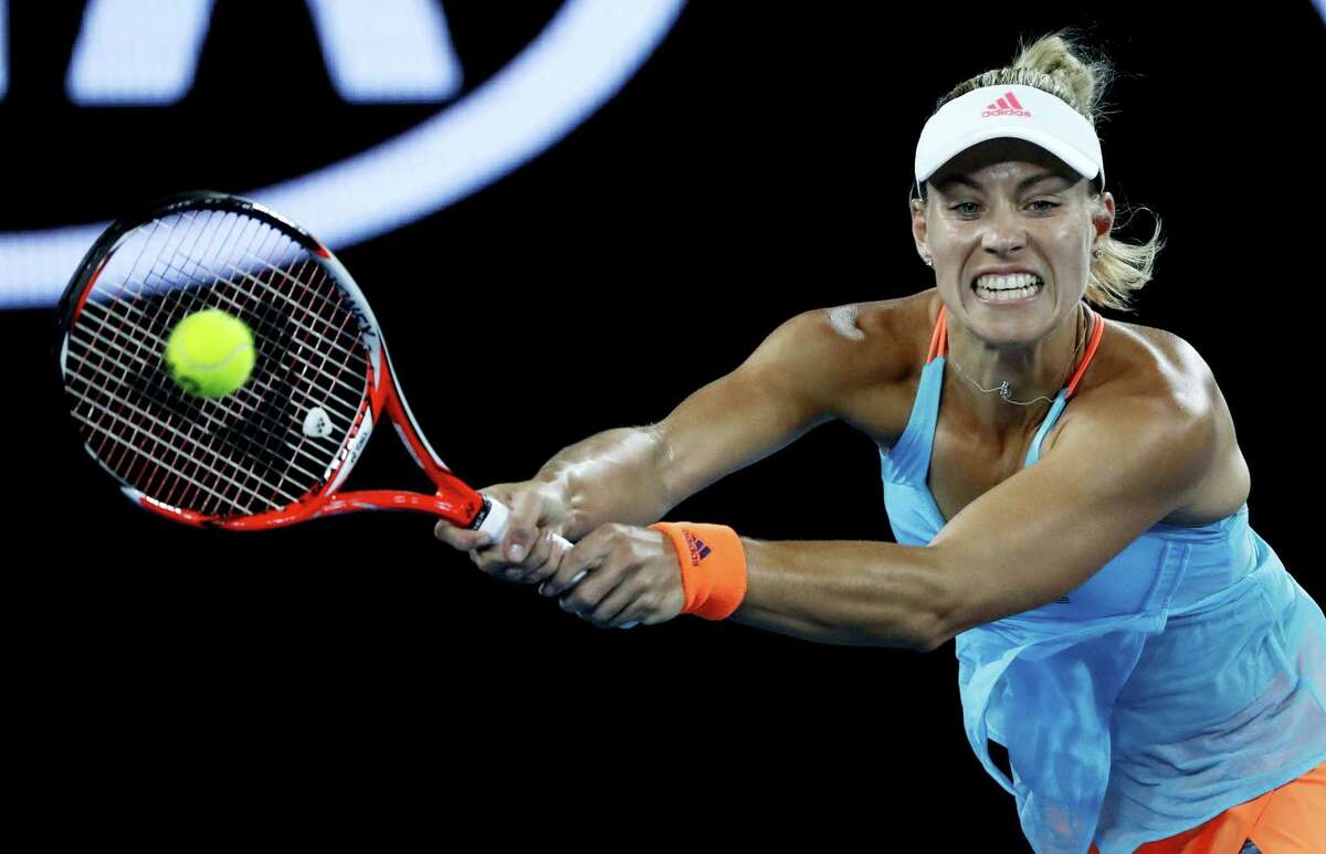 Germany’s Angelique Kerber makes a backhand return to United States’ Coco Vandeweghe during their fourth round match at the Australian Open tennis championships in Melbourne, Australia on Jan. 22, 2017.