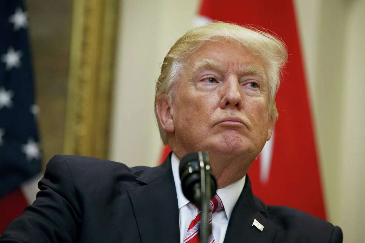 President Donald Trump listens as Turkish President Recep Tayyip Erdogan speaks in the Roosevelt Room of the White House in Washington on May 16, 2017. The White House on Tuesday defended President Donald Trump’s disclosure of classified information to senior Russian officials as “wholly appropriate,” as Trump tried to beat back criticism from fellow Republicans and calm international allies increasingly wary about sharing their secrets with the new president.