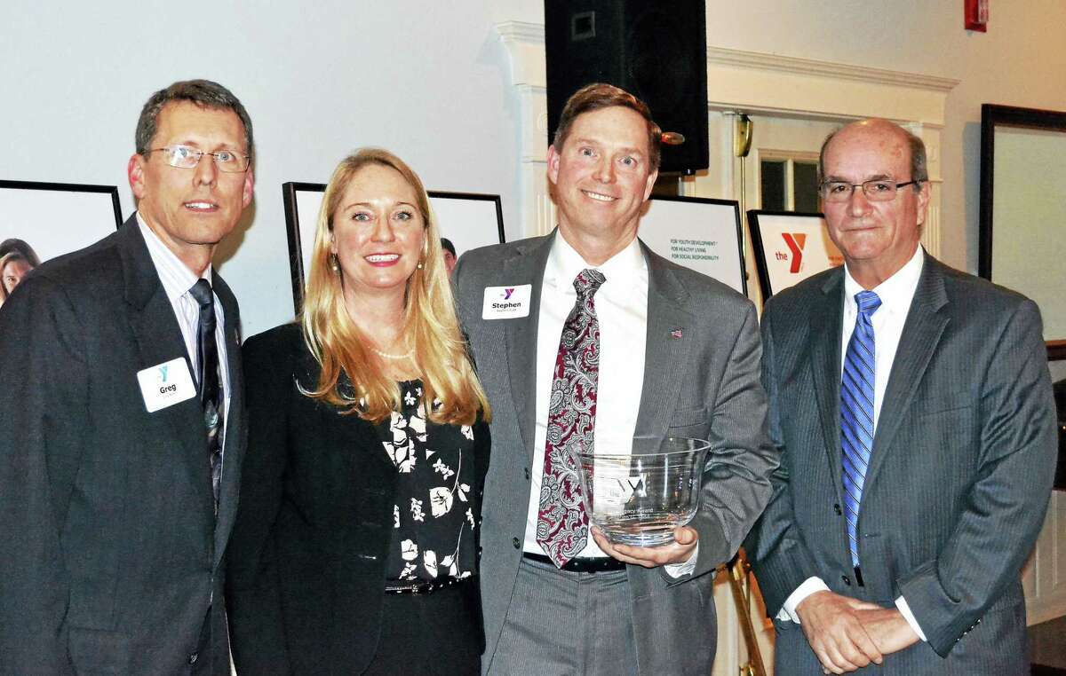 Northwest CT YMCA Board President Joseph Greco, left, and CEO Greg Brisco, right, join Legacy Award winner Stephen Todd and his sister, Sharon Todd, after the presentation of the award on March 8 at the Y’s annual recognition reception on March 8.