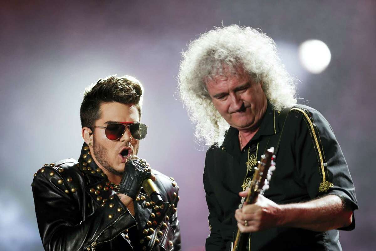 FILE - In this Sept. 19, 2015 file photo, Adam Lambert, left, and Brian May of the Queen + Adam Lambert perform at the Rock in Rio music festival in Rio de Janeiro, Brazil. Many of the rock ‘n’ roll bands that were huge in 1977 will comprise a big part of the summer concert market 40 years later. Concert industry executives say nostalgia acts are still reliable sellers, with satellite and classic rock radio keeping their hits alive.