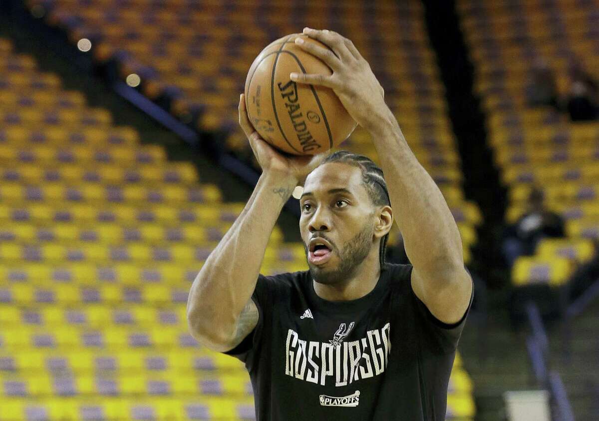 San Diego State forward Kawhi Leonard bites his jersey during an