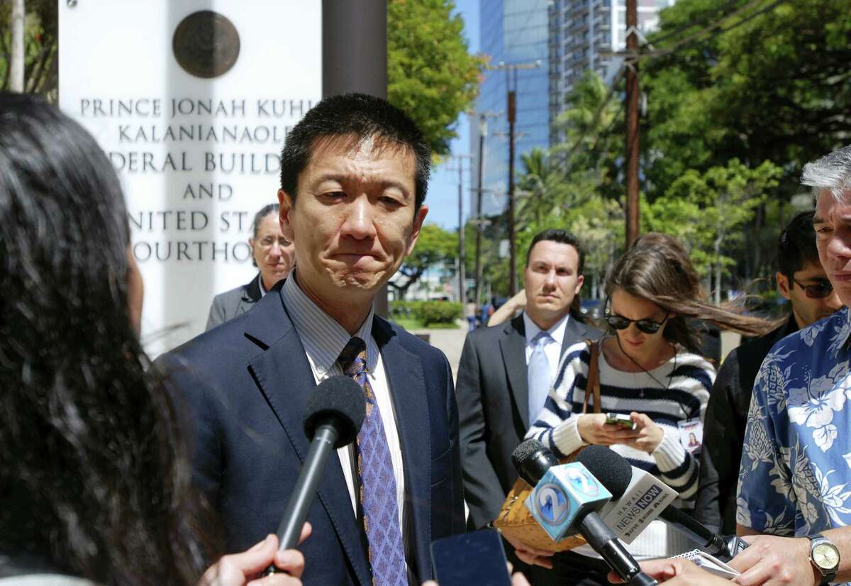 In this March 29, 2017 photo, Hawaii Attorney General Douglas Chin speaks outside federal court in Honolulu, Hawaii. Three federal appellate court judges in Seattle on May 15, 2017 will hear the appeal of Hawaii’s challenge to President Trump’s travel ban targeting six predominantly Muslim countries.