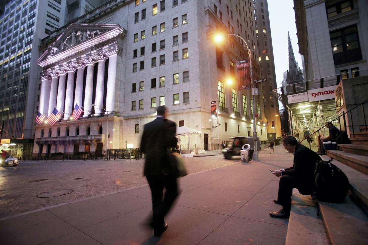 A man walks to work on Wall Street, near the New York Stock Exchange.