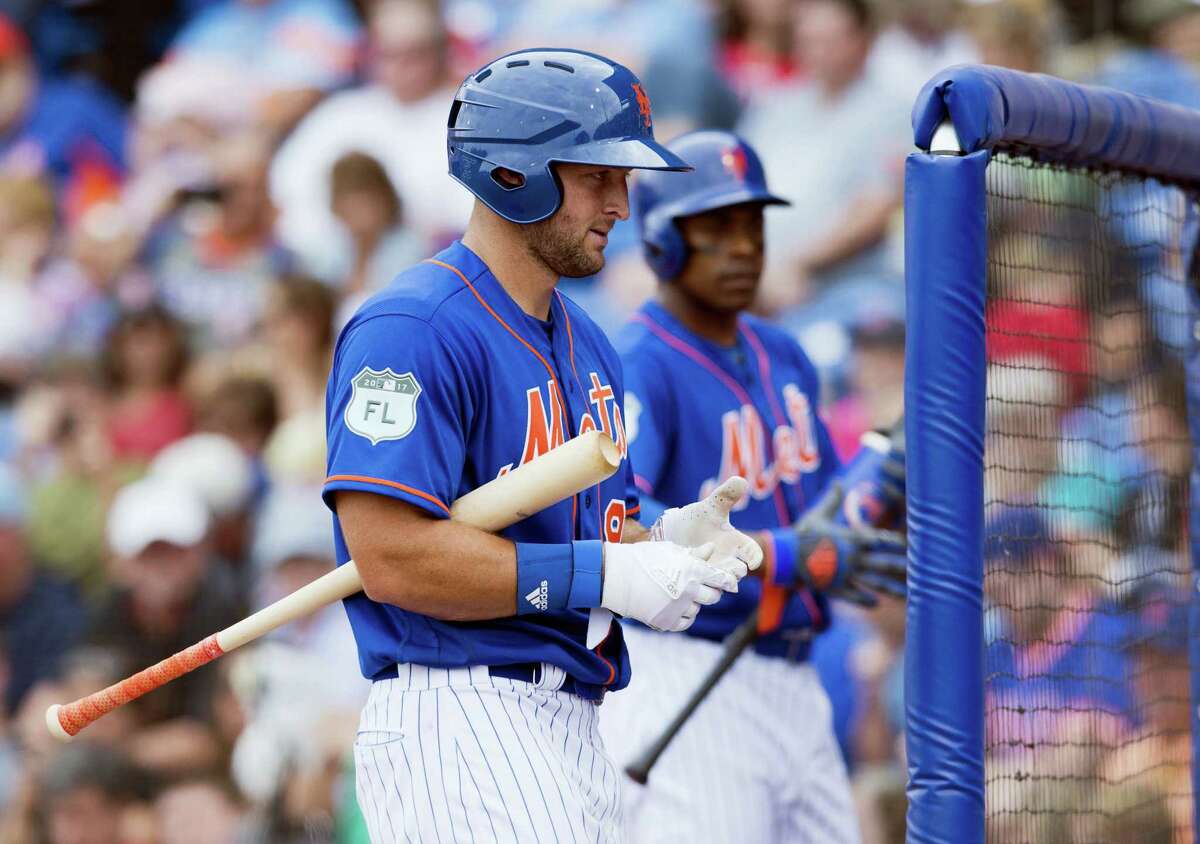 New York Mets designated hitter Tim Tebow walks back to the dugout during a spring training baseball game against the Boston Red Sox in the sixth inning on Wednesday at First Data Field in Port St. Lucie. The Mets won 8-7.