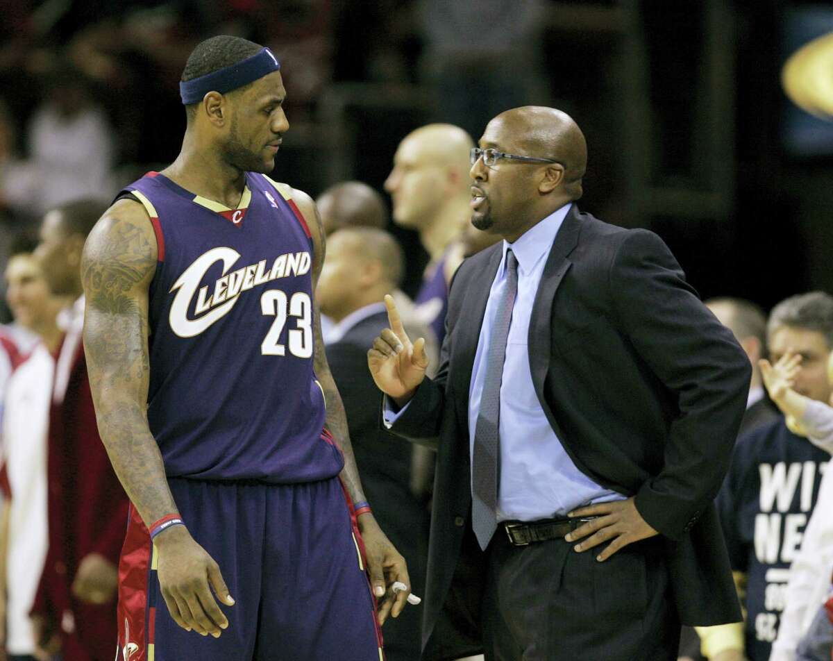Cleveland Cavaliers coach Mike Brown talks strategy with LeBron James.