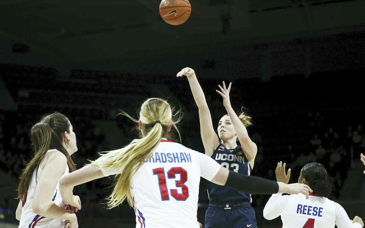 UConn’s Katie Lou Samuelson takes a shot as SMU’s Alicia Froling (10), Klara Bradshaw (13) and Mikayla Reese (4) defend during the first half on Saturday.