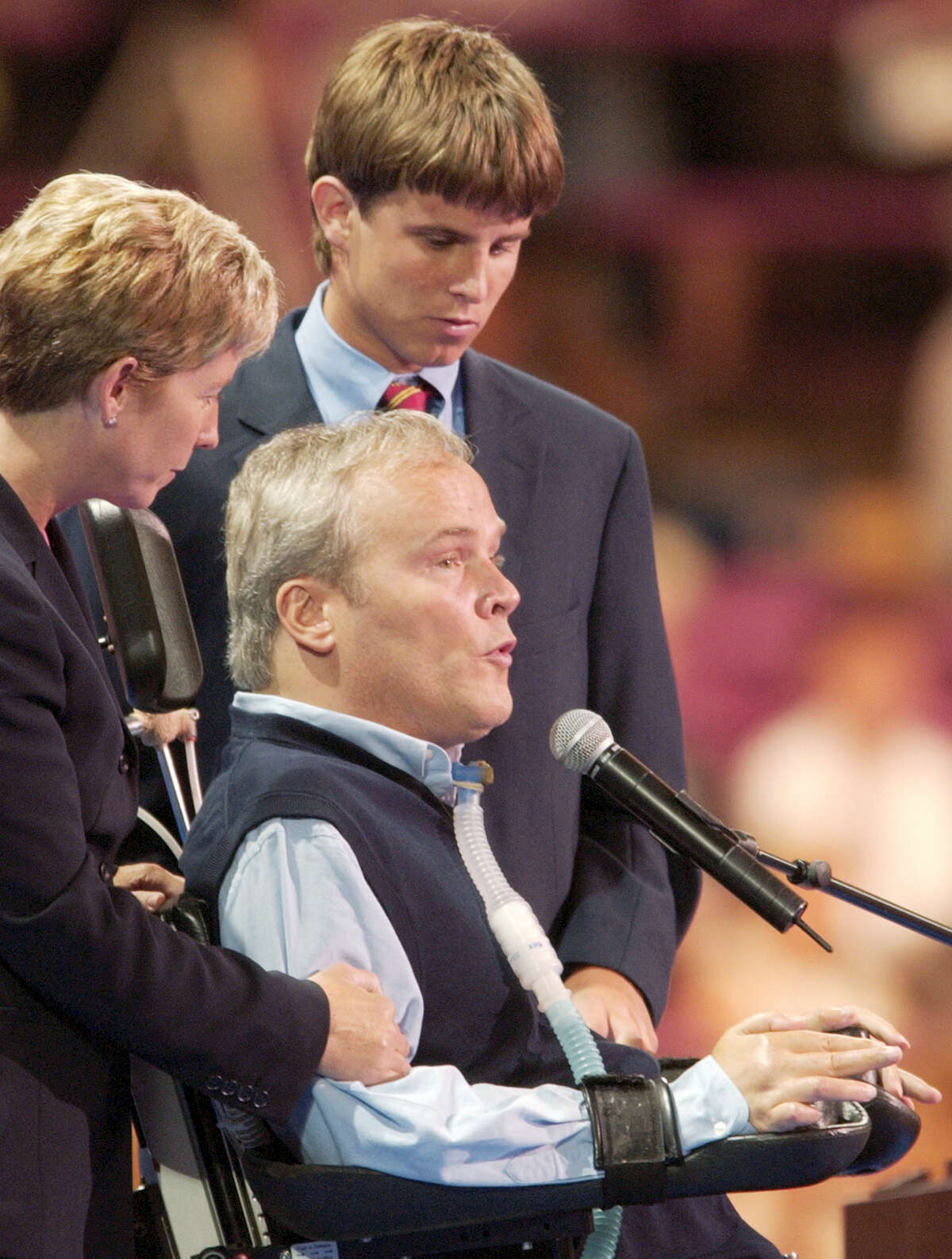 Disabled former New York City police officer Steven McDonald addresses delegates, as family members stand beside him at Madison Square Garden during the Republican National Convention in New York in 2004. McDonald, who was paralyzed by a bullet and became an international voice for peace after he publicly forgave the gunman, died Tuesday, Jan. 10, 2017, at the age of 59.