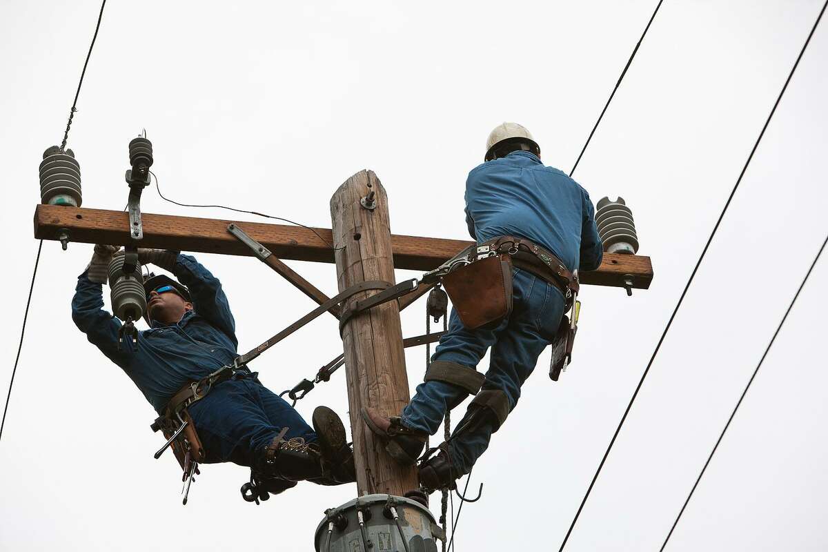 CPS workers help restore power after a storm.