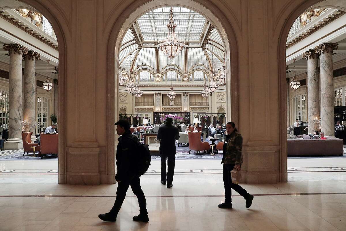 Guests walk by the Gargen Court at the Palace Hotel in San Francisco, Calif., on Tuesday, August 15, 2017. The Palace Hotel is refurbishing the classic glass and old ceiling at the famous 118 yr old Garden Court. The structure was retrofitted after severe damage during the 1989 earthquake.