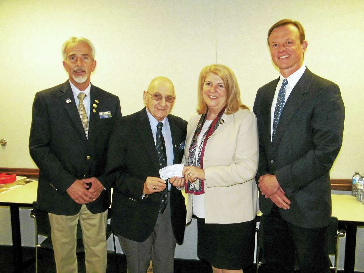 Courtesy of CHH Charlotte Hungerford Hospital's Diabetes Education Fund recently received a $750 donation from The Harwinton Lions Club to help fund programs and the newest continuous glucose monitoring technology for its Diabetes patients. From left, Harwinton Lions President Bruce Richard and Past President David Neri present the donation to Lois Pelletier, RN, CDE, and Dr. Egils Bogdanovics of the CHH Diabetes Center.