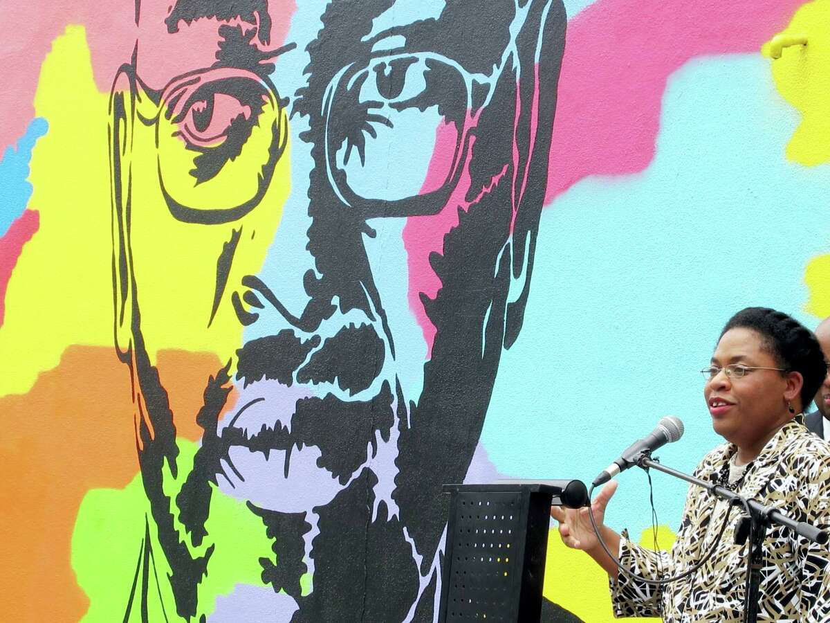 In this May 13, 2016, file photo, Jennifer Pinckney speaks beside an image of her late husband, the Rev. Clementa Pinckney, one of the victims of the shooting at Charleston’s Emanuel AME Church, during the unveiling of the mural on a building a few blocks from the sanctuary. Convicted Charleston church shooter Dylann Roof spoke to the jury for the first time at his death penalty trial Wednesday, telling them there’s nothing wrong with him psychologically and that he is not trying to keep any secrets from them. As their first witness, prosecutors called Pinckney. During more than two hours on the stand, Pinckney described her husband as an affable figure who garnered respect from all corners in his roles as legislator and preacher but was a goofy family man in private with his two young daughters.