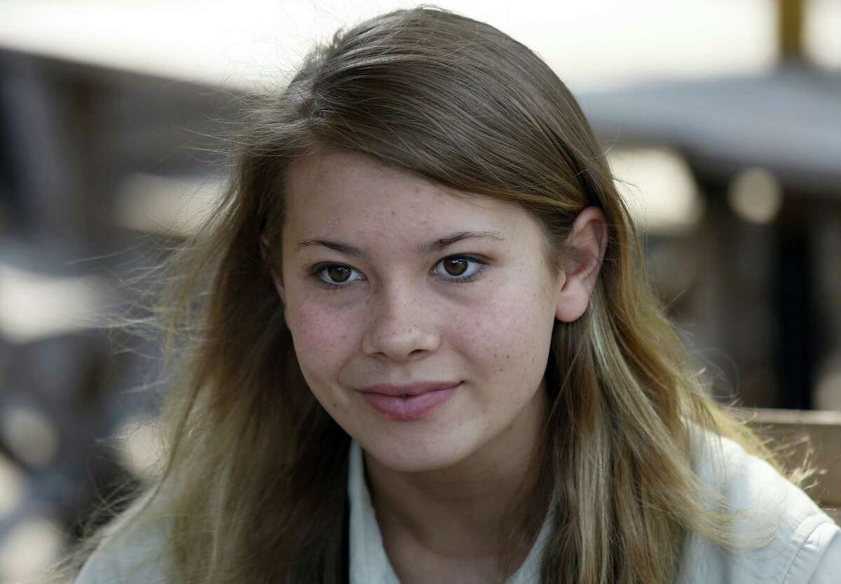 AP Photo/Vincent Yu, File In this Thursday, Oct. 24, 2013, file photo, Bindi Irwin, Australian-based animal activist and television personality, listens to reporter’s questions during an interview in Hong Kong. Irwin paid tribute with a post about her father, the late “Crocodile Hunter” Steve Irwin, on what would have been his 55th birthday on Feb. 22, 2017.