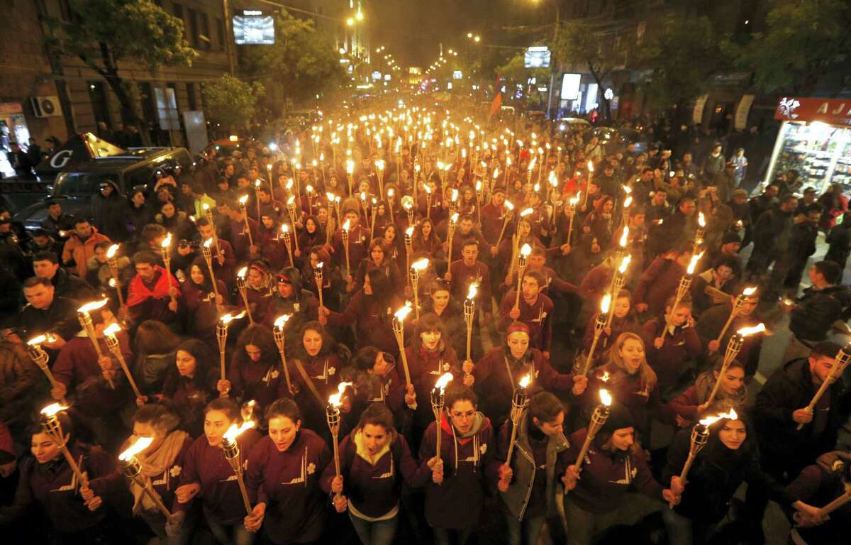 Armenians walk with torches to the monument to the victims of mass killings by Ottoman Turks, in Yerevan, Armenia, April 24, 2015.