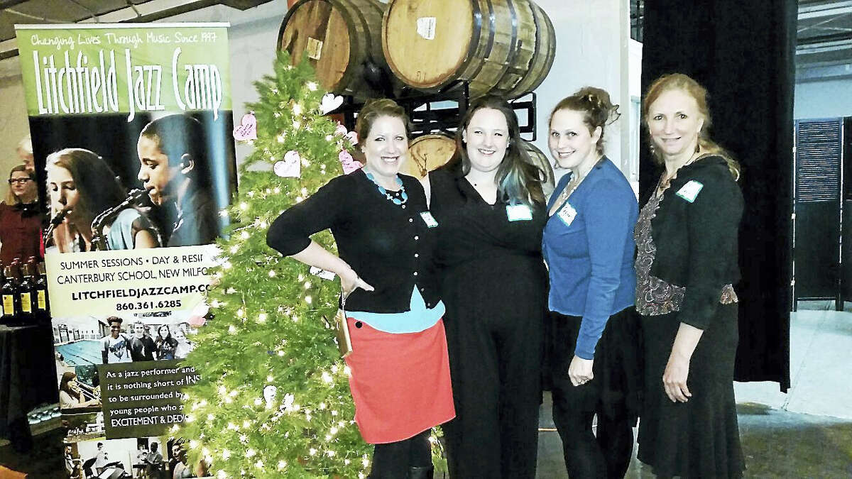 Photo by N.F. AmberyRachel Steier-White, Ellie Lambert, Tegan Ryan and Lisa Cruse of the Litchfield Performing Arts supervised the festivities at the first annual “Spirits of Love” Valentine’s Day event at Litchfield Distillery at 569 Bantam Road in Litchfield on Saturday, Feb. 11. Through door tickets sold and a “Giving Tree”, left, where guests donated checks for specific solicited materials written up a paper ornament and hung upon a holiday tree, the event raised an estimated $5,000 to benefit the Litchfield Jazz Camp, a summer program that instructs young people in jazz.