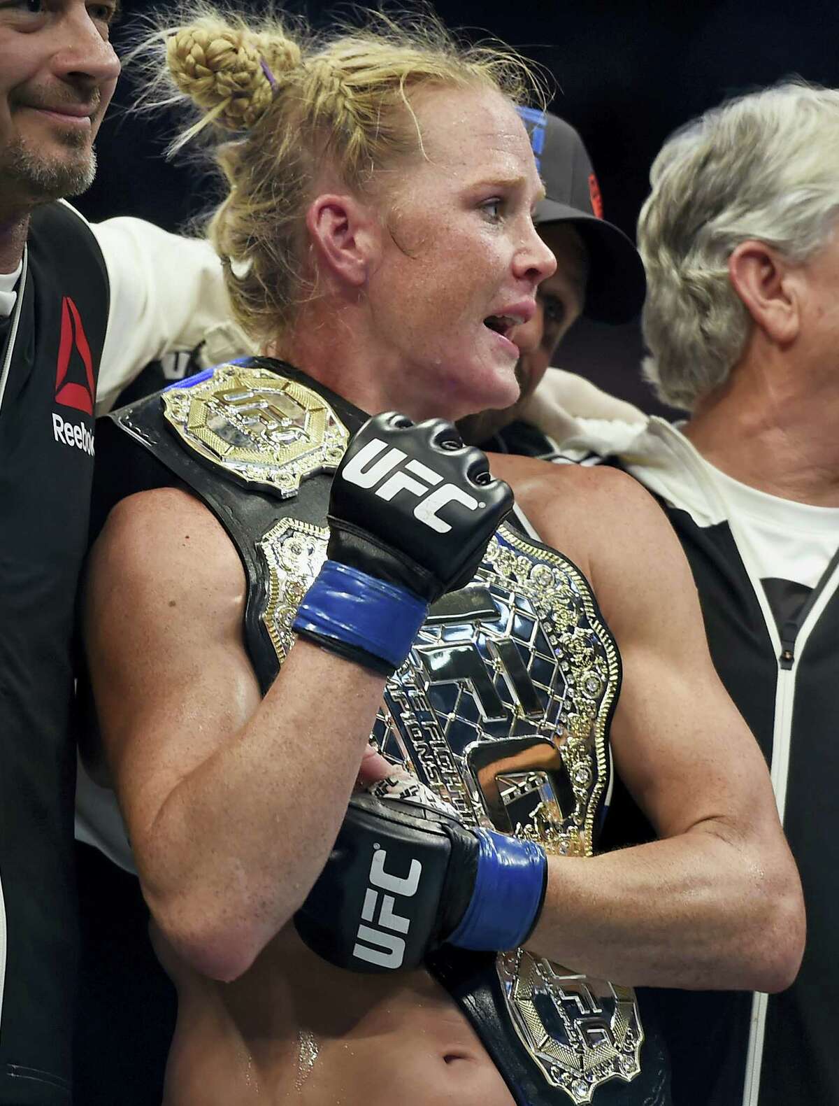 Holly Holm holds the champion belt after defeating Ronda Rousey in 2015.