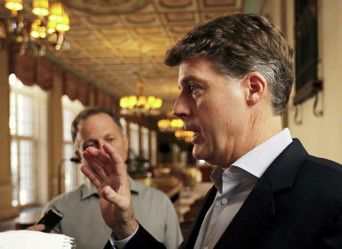 New York Yankees owner Hal Steinbrenner talks with reporters following a meeting with MLB owners on Thursday in Palm Beach, Fla.