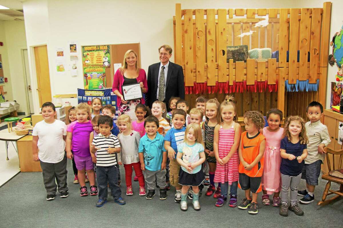 CONTRIBUTED PHOTO State Rep. Michelle Cook was recognized with a ceremony at the Torrington Child Care Center Tuesday.