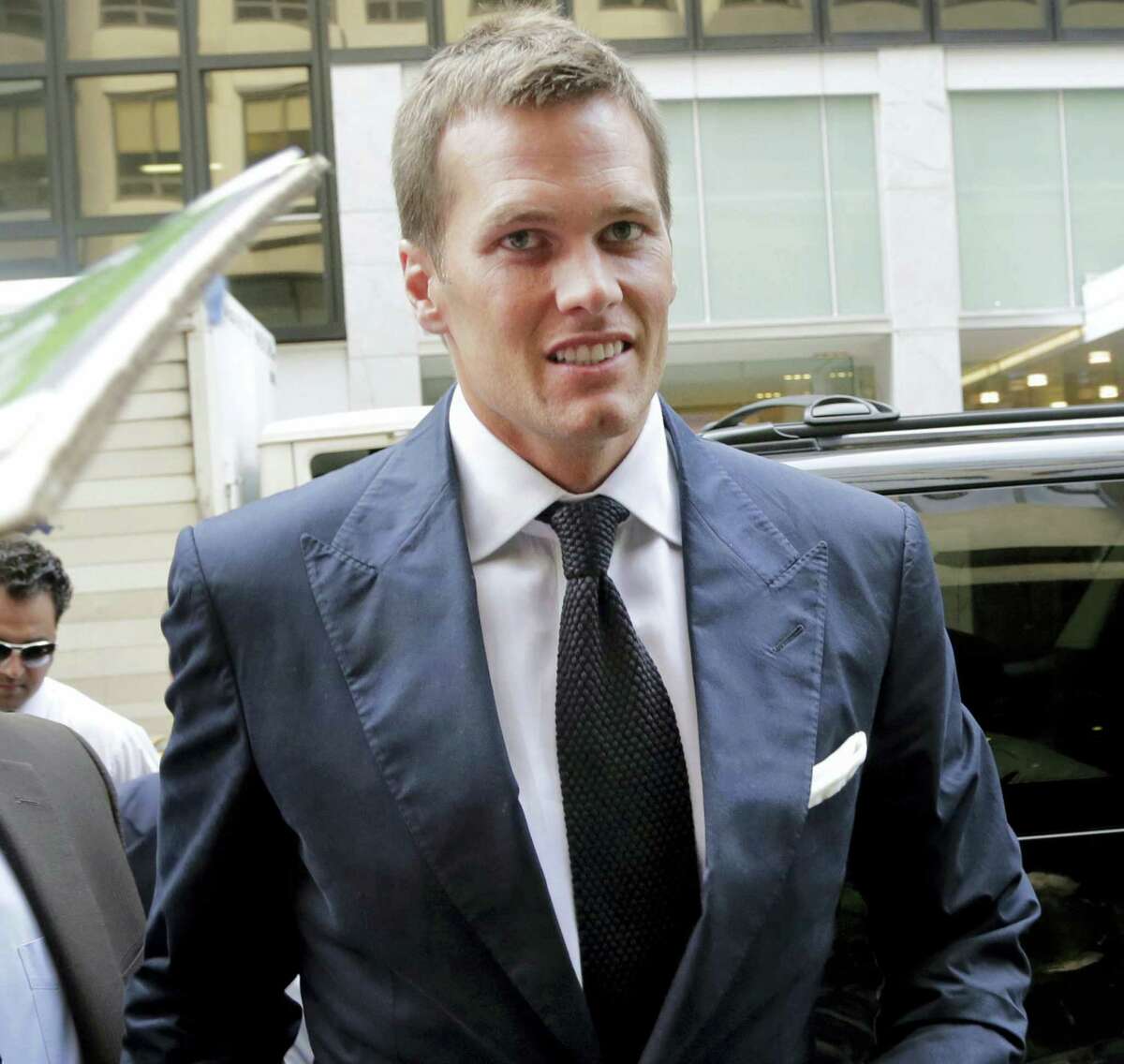 In this June 23, 2015 photo, New England Patriots quarterback Tom Brady arrives for his appeal hearing at NFL headquarters in New York. A federal appeals court ruled April 25, 2016 that Tom Brady must serve a four-game “Deflategate” suspension imposed by the NFL, overturning a lower judge and siding with the league in a battle with the players union.