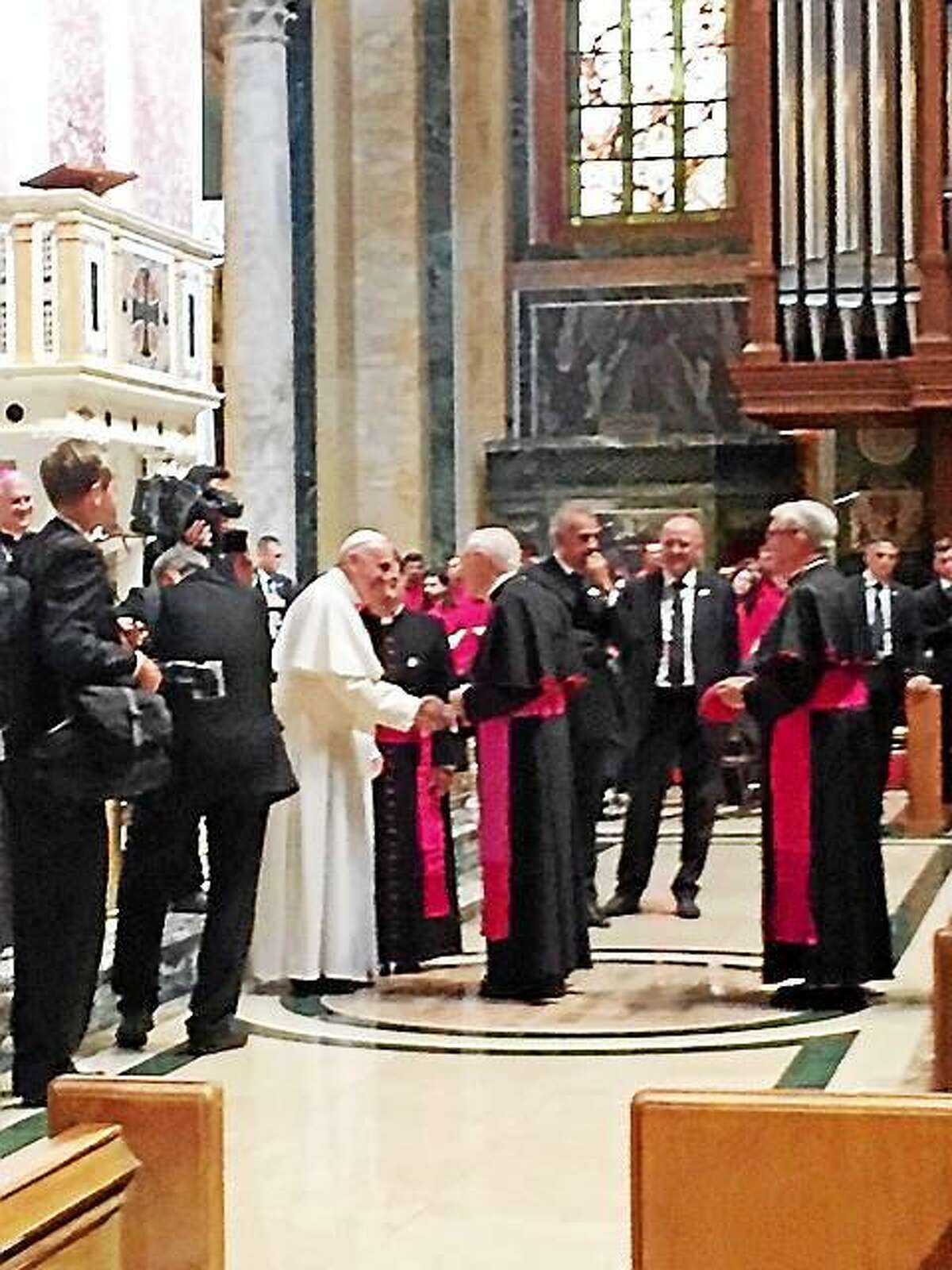 Archbishop Leonard P. Blair of the Archdiocese of Hartford being presented to Pope Francis at the Cathedral of St. Matthew the Apostle in Washington, D.C. during the Popeís meeting with U.S. bishops last Wednesday.