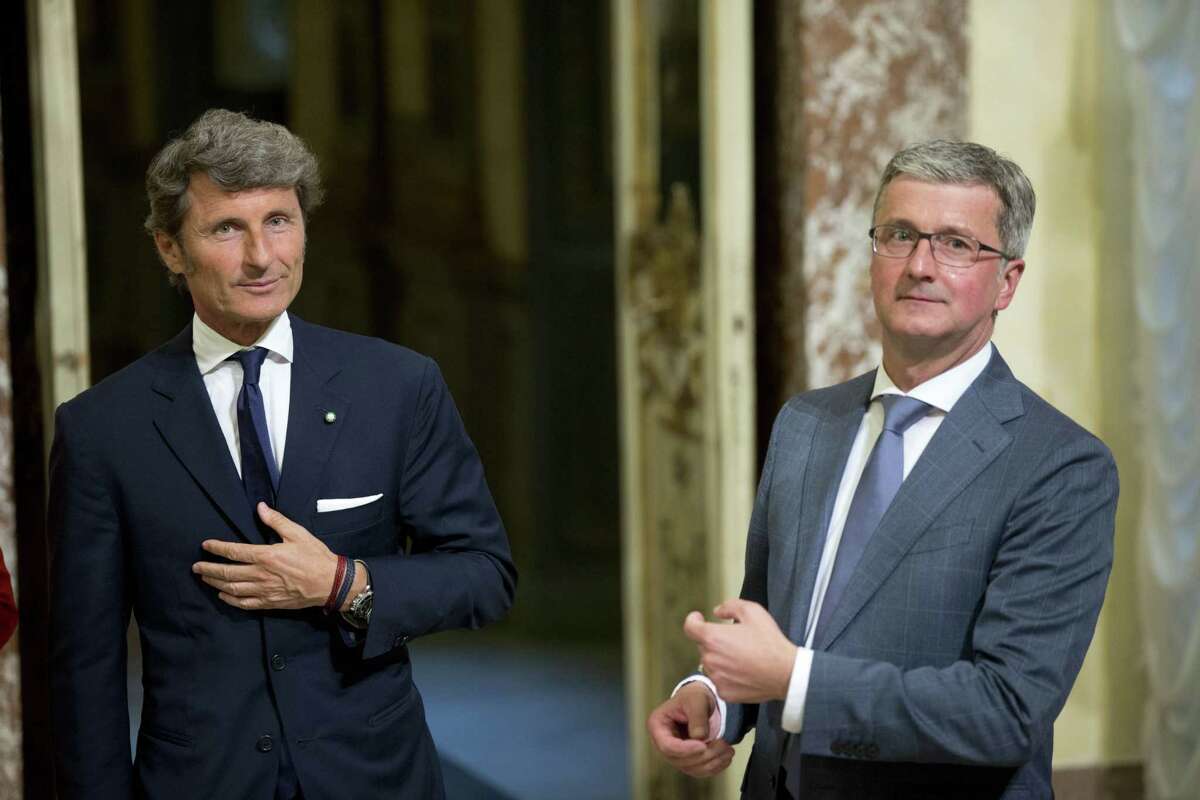 The CEO of Audi, Rupert Stadler, right, and Automobili Lamborghini President and Chief Executive Officer Stephan Winkelmann pose for photographers at Rome's Palazzo Chigi Government office, Wednesday, May 27, 2015. (AP Photo/Alessandra Tarantino)