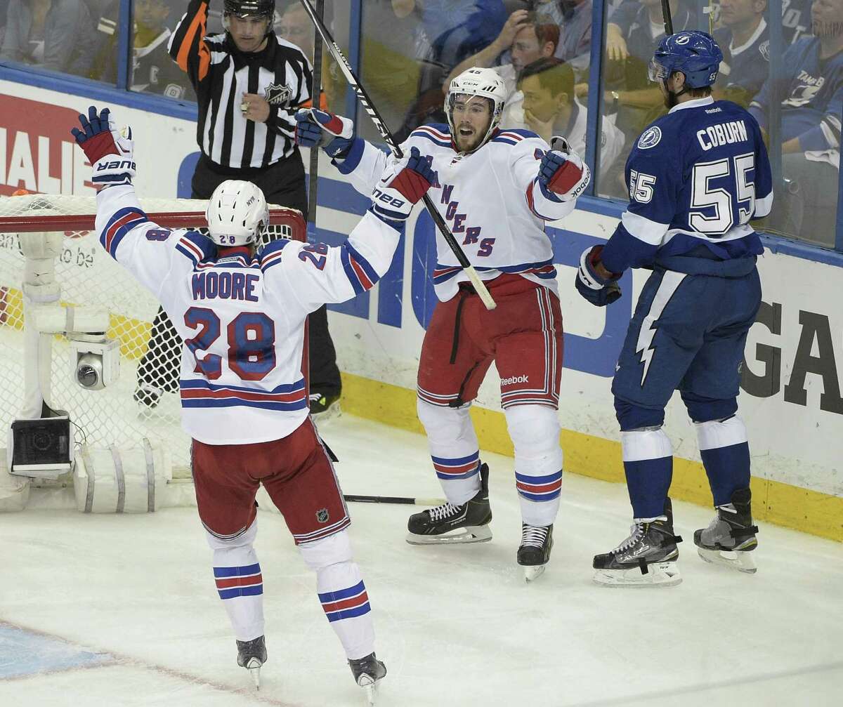 New York Rangers left wing James Sheppard, center rear, celebrates his goal with center Dominic Moore (28) during the third period of Game 6 of the Eastern Conference finals against the Tampa Bay Lightning.