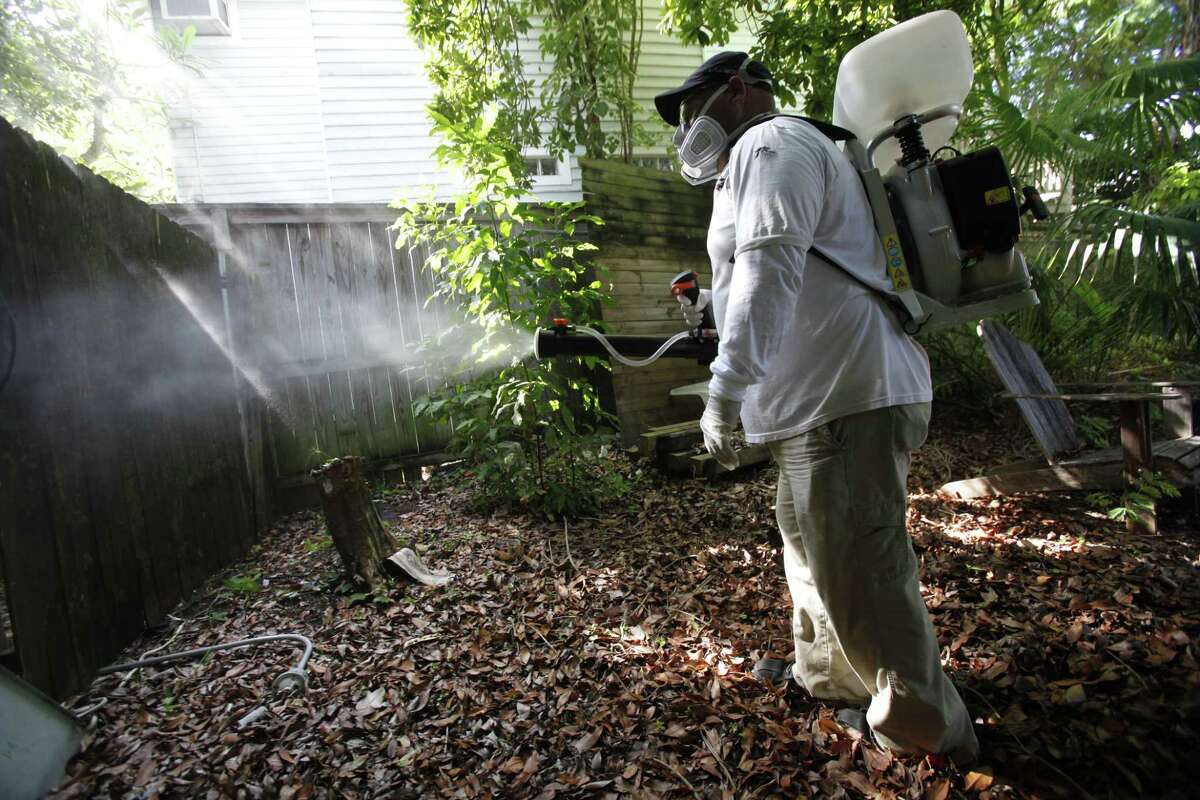 In this Oct. 4, 2012 photo, Jason Garcia, a field inspector with the Florida Keys Mosquito Control District, tests a sprayer that could be used in the future to spray pesticides to control mosquitos in Key West, Fla.