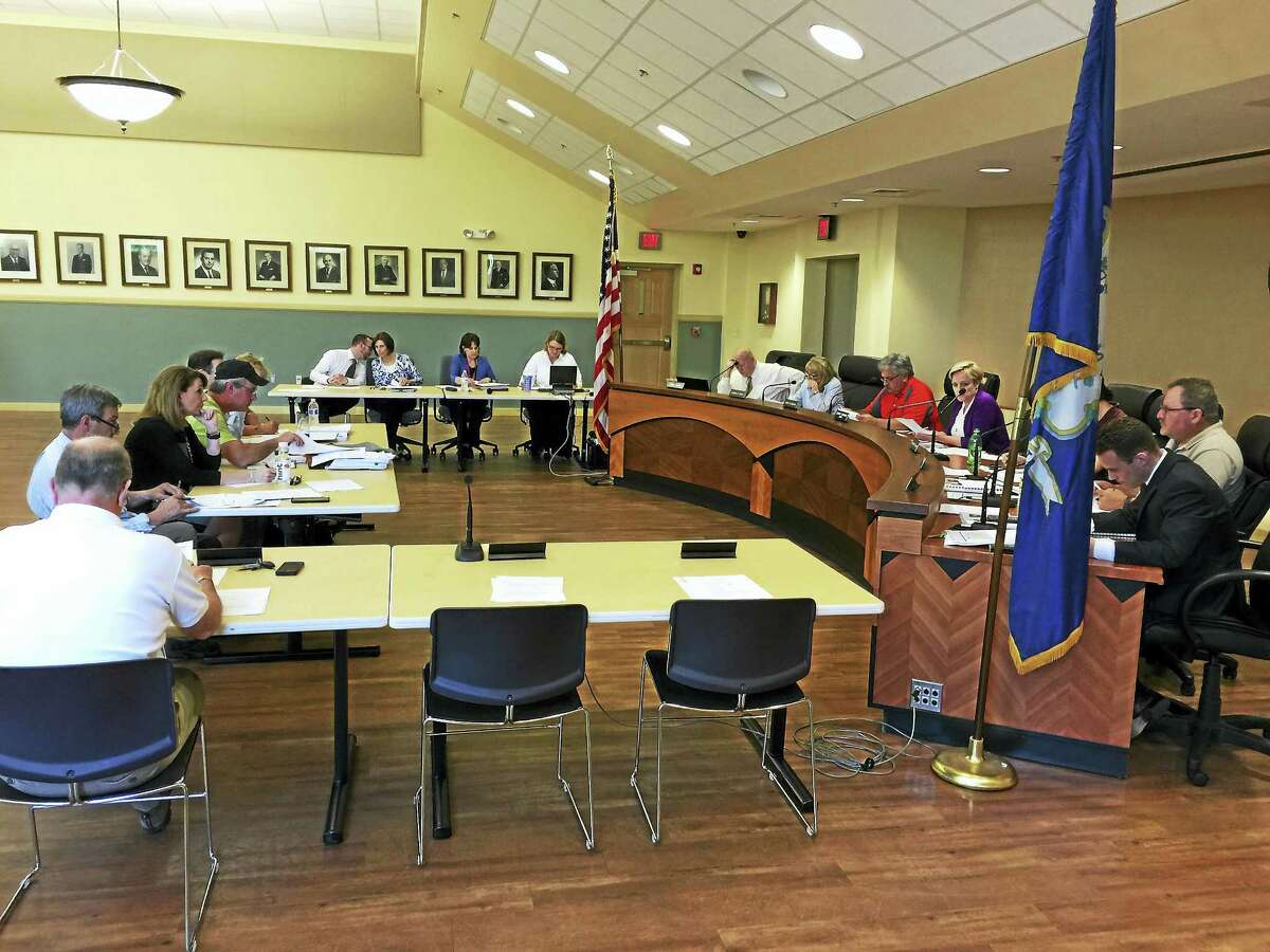 BEN LAMBERT — REGISTER CITIZEN The Board of Finance Wednesday discussed the projected tax rate for the coming fiscal year and approved measures to address an expected overrun in the school budget.