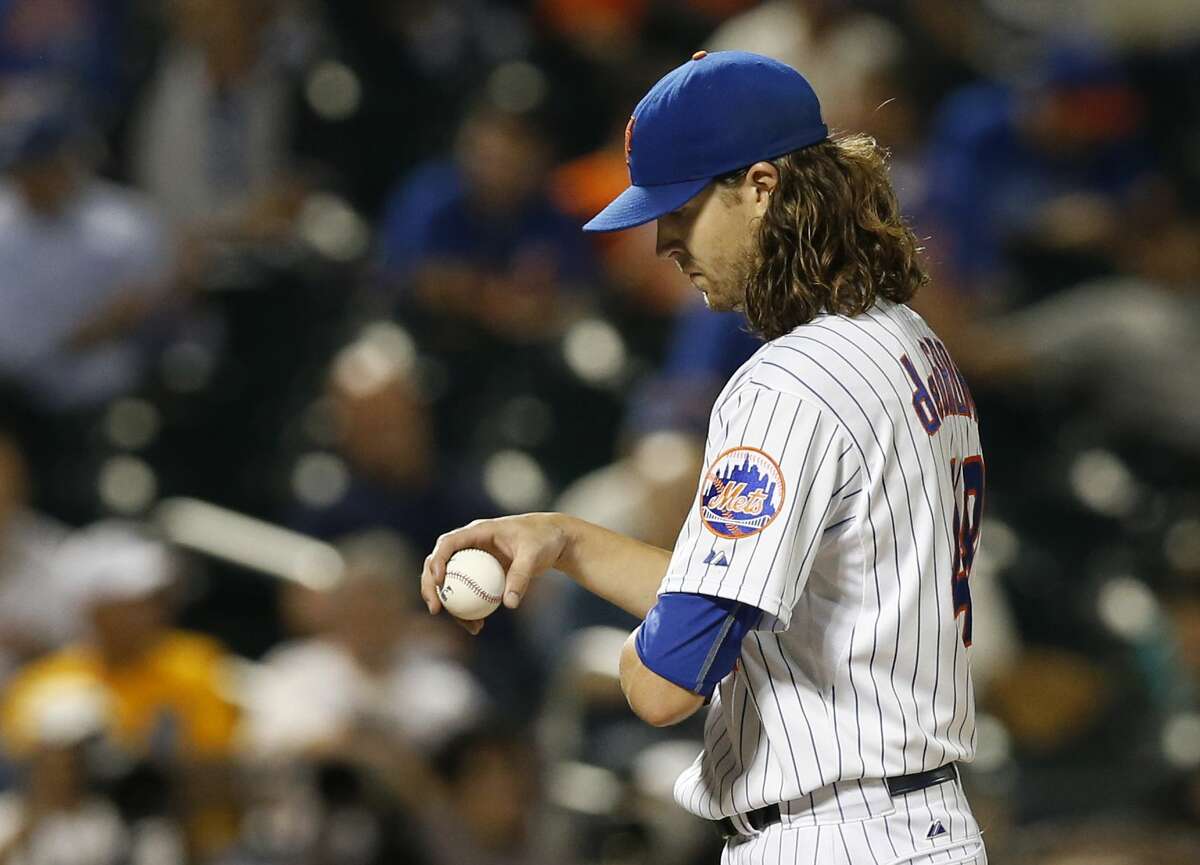 Mets starter Jacob deGrom reacts after allowing three runs in the fourth inning Tuesday against the Miami Marlins in New York.