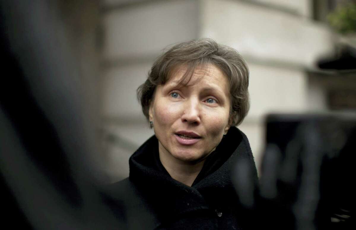 In this Thursday, Dec. 13, 2012 file photo, Marina Litvinenko, the widow of former Russian intelligence officer Alexander Litvinenko, speaks to the media as she leaves at the end of a pre-inquest review at Camden Town Hall in London. On Thursday Jan. 21, 2016, British judge Robert Owen will release the long-awaited findings of a public inquiry into the killing of Litvinenko — and is likely to point a finger at elements in the Russian state.