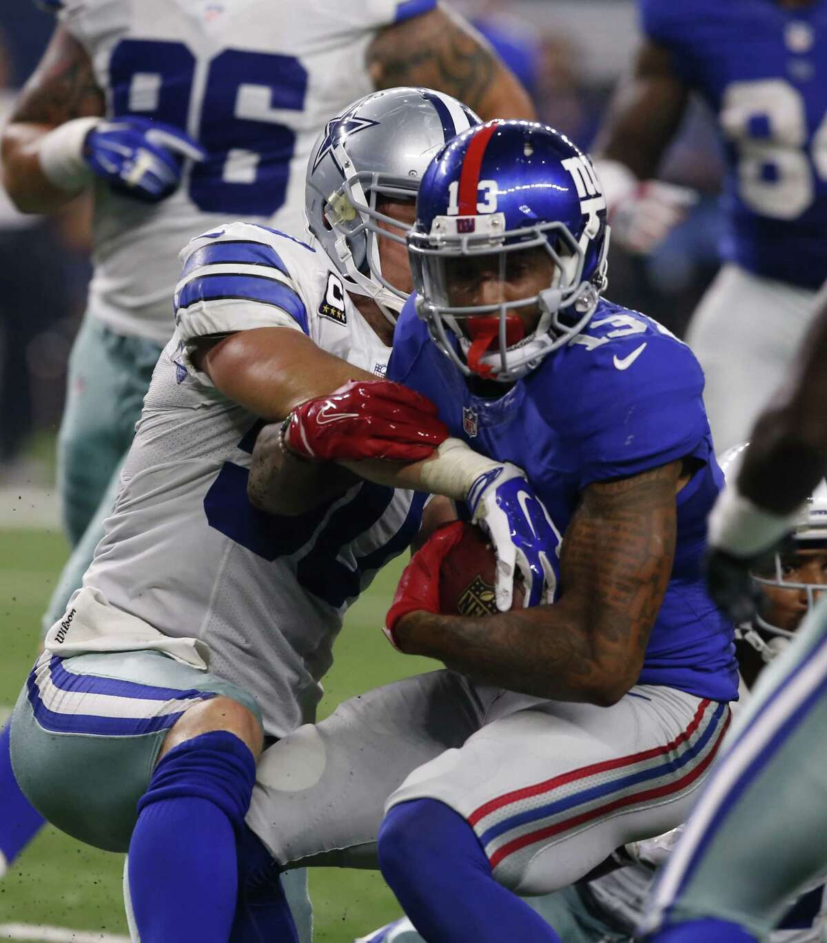 New York Giants receiver Odell Beckham is tackled by Dallas Cowboys linebacker Sean Lee during Sunday night’s game in Arlington, Texas.