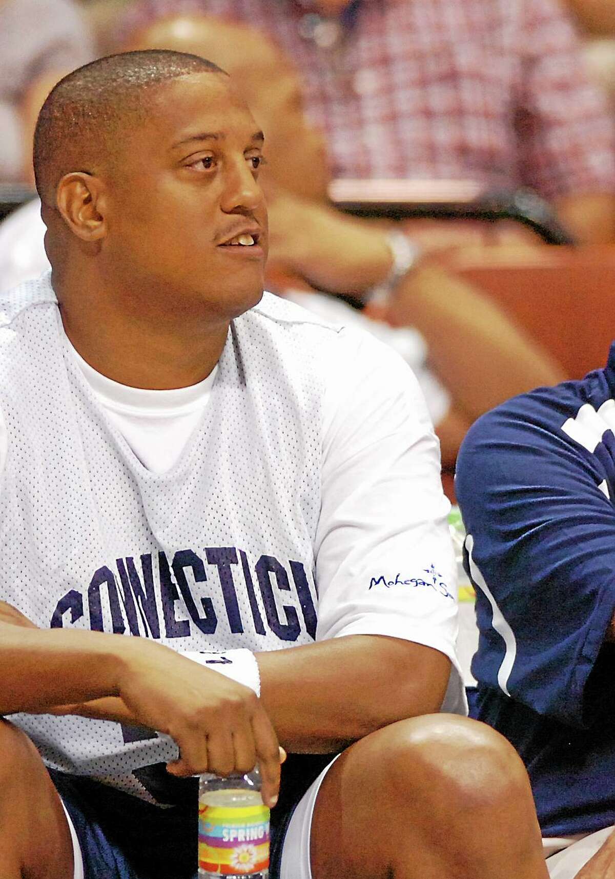 This Aug. 8, 2008 photo shows former NBA and University of Connecticut player Tate George during the Jim Calhoun Celebrity Classic basketball game at the Mohegan Sun Arena in Uncasville, Conn. A federal jury convicted C. Tate George on four counts of wire fraud last fall.