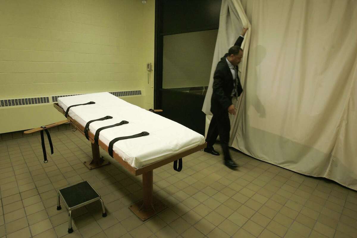 In this Nov. 2005, file photo, public information director Larry Greene is shown in the death chamber at the Southern Ohio Correctional Facility in Lucasville, Ohio.