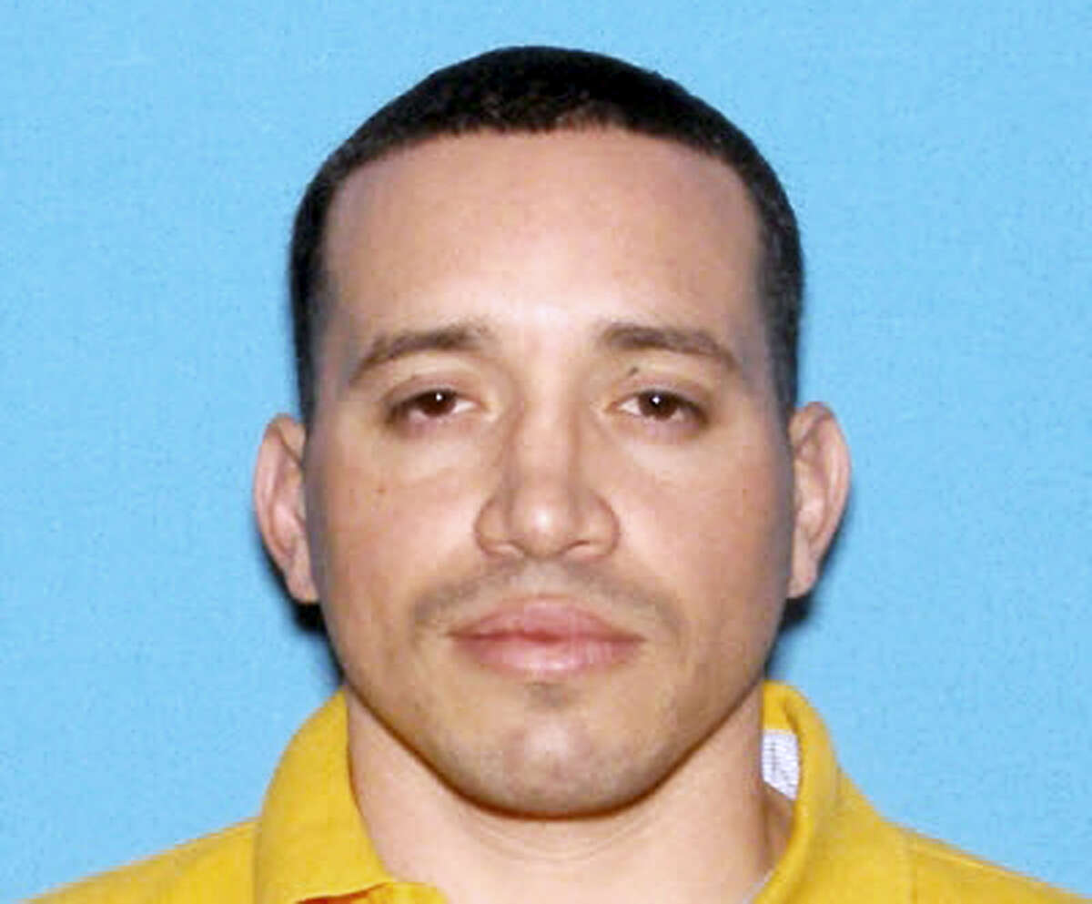This undated identification photo released by the Massachusetts State Police shows Jorge Zambrano, killed Sunday, May 22, 2016, during an exchange of gunfire with police at an apartment building in Oxford, Mass. Zambrano had been suspected in the shooting death of Auburn, Mass., Police Officer Ronald Tarentino during a traffic stop early Sunday morning.