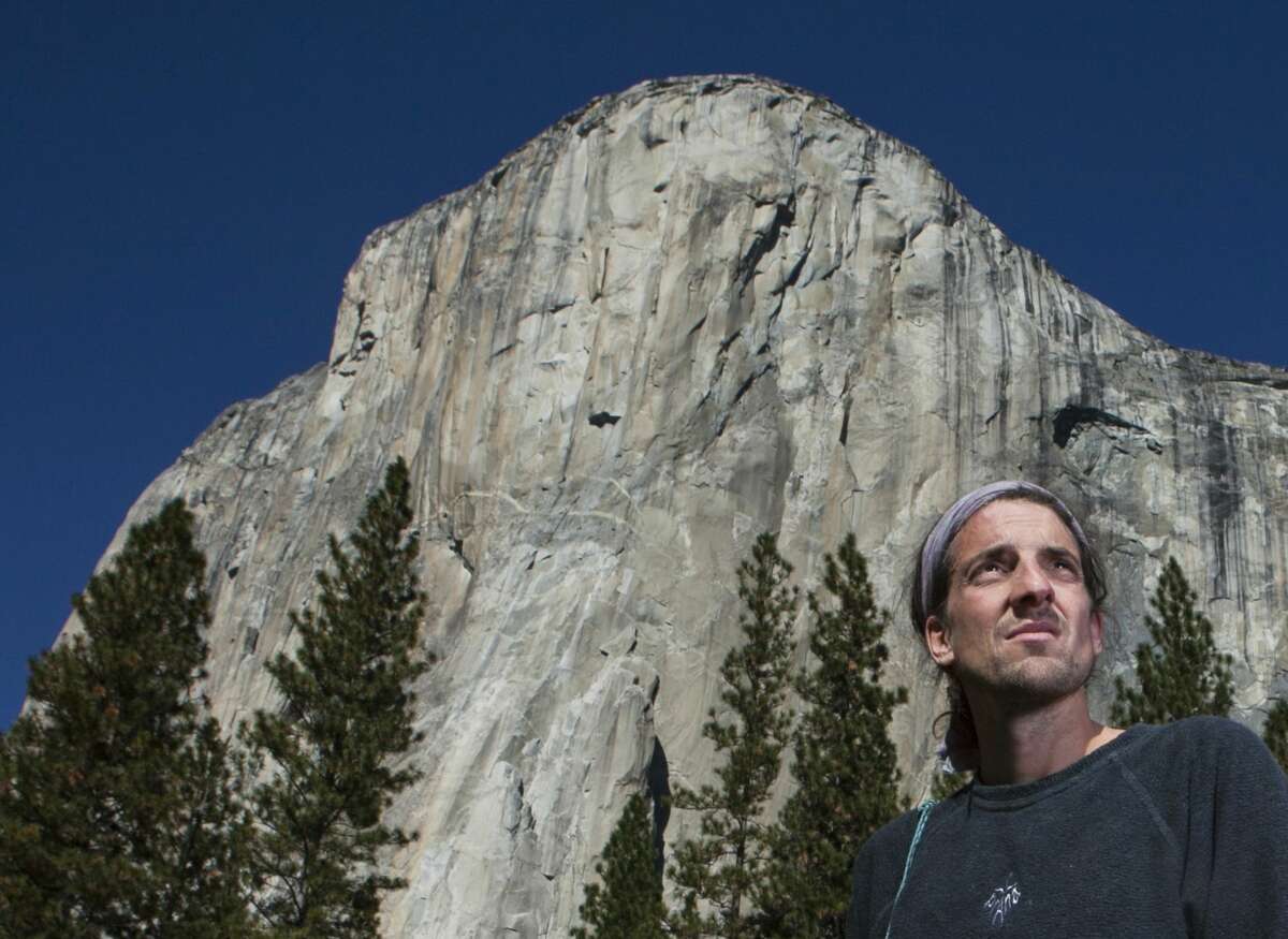 In this Nov. 15, 2010 photo provided by Tomas Ovalle, extreme athlete Dean Potter stands in front of El Capitan after a speed climbing attempt in Yosemite National Park, Calif.