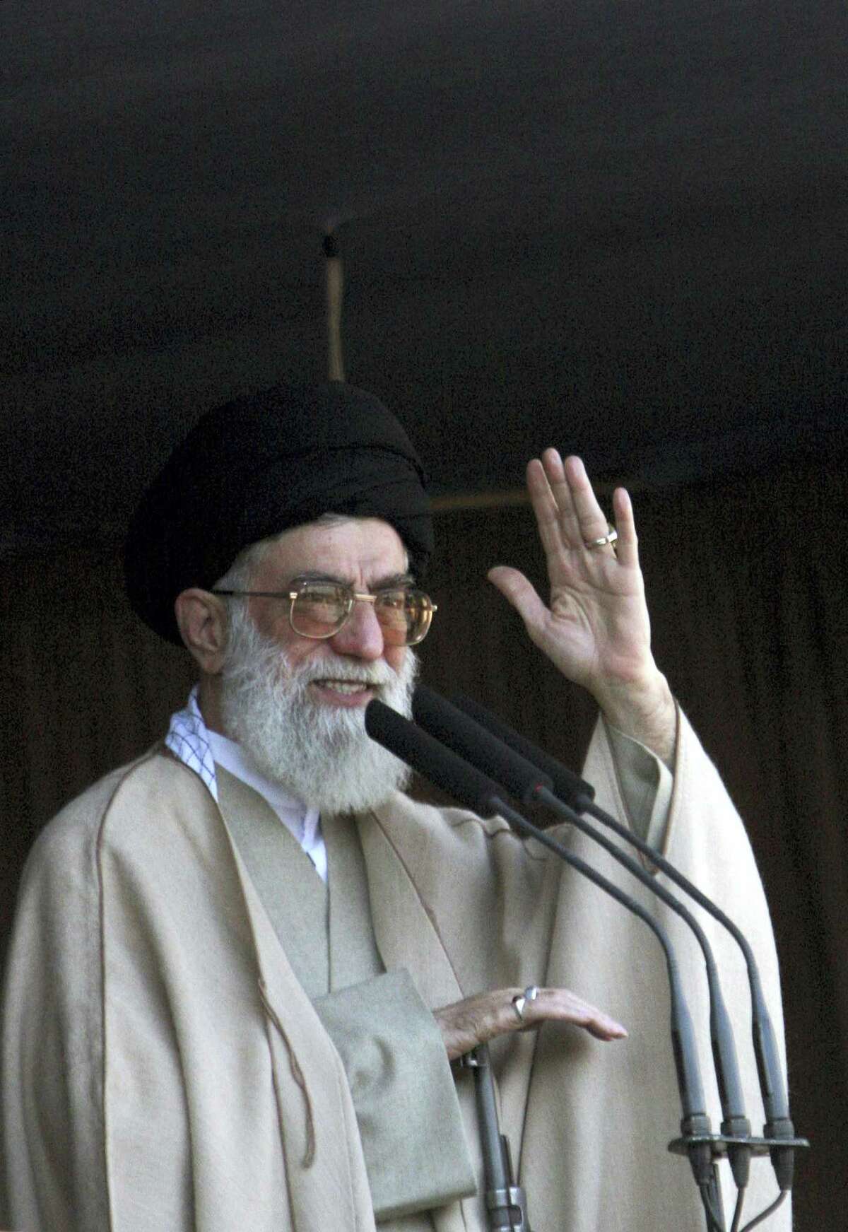 In this Friday Nov. 4, 2005, file photo. Iran’s supreme leader Ayatollah Ali Khamenei, waves to people who attend in Eid al-Fitr prayer the holiday marking the end of the Muslim holy month of Ramadan in Tehran. In his first public remarks since international sanctions were lifted following a U.N. report that Iran had fully complied in scaling back its nuclear program, Khamenei said Tehran should “exercise care the other party implements its commitments.”