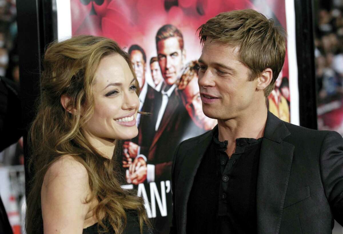 In this June 5, 2007, file photo, Angelina Jolie and Brad Pitt arrive at the premiere of “Ocean’s Thirteen” in Los Angeles, Calif. Angelina Jolie Pitt has filed for divorce from Brad Pitt, bringing an end to one of the world’s most star-studded, tabloid-generating romances. An attorney for Jolie Pitt, Robert Offer, said Tuesday, Sept. 20, 2016, that she has filed for the dissolution of the marriage.