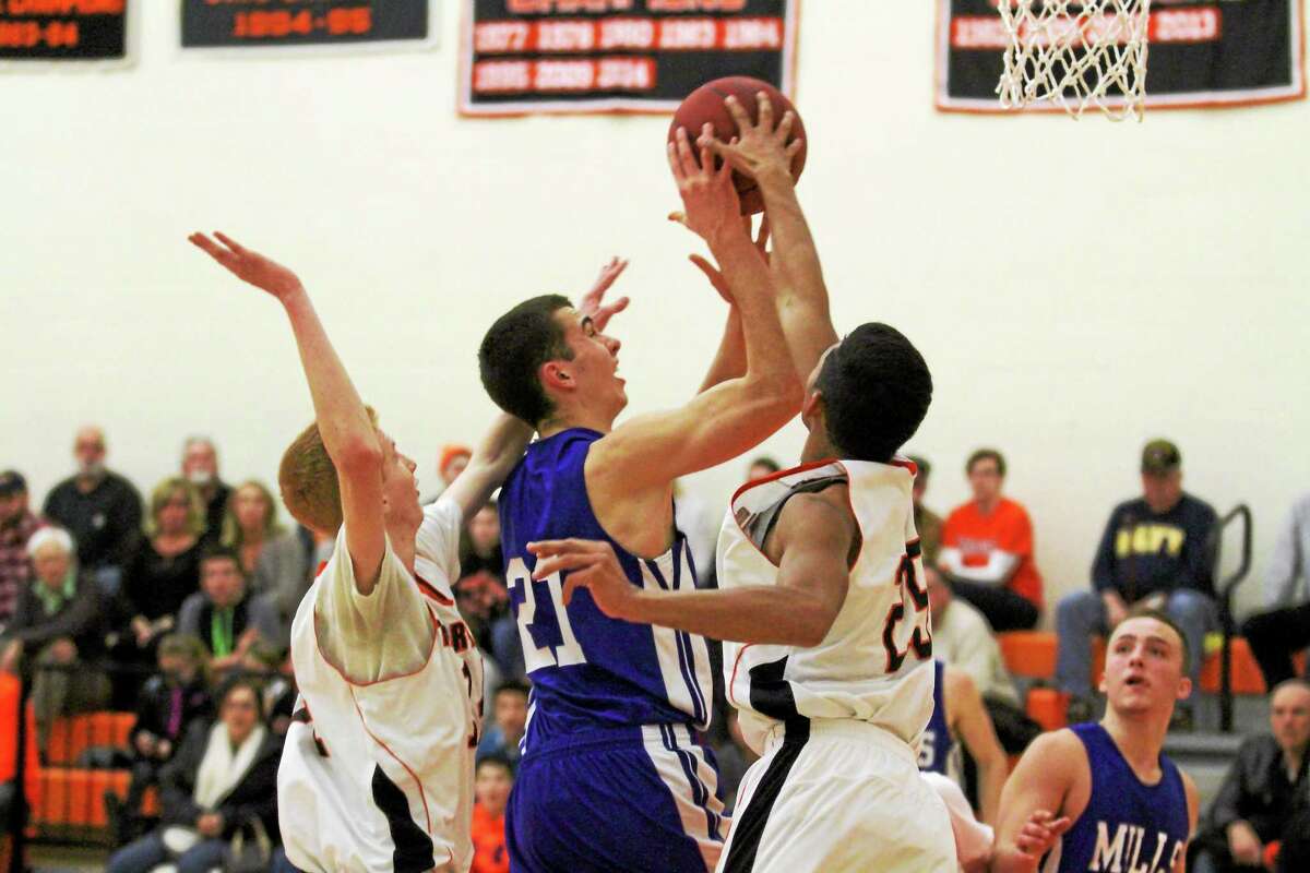 Marianne Killackey - Special to Register Citizen Lewis Mills' Nate Cook goes up for a shot against Terryville Thursday night.