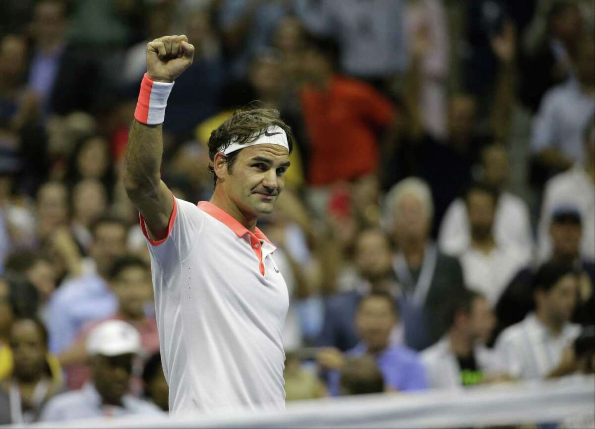 Roger Federer waves to the crowd after defeating Stan Wawrinka in the semifinals on Friday.