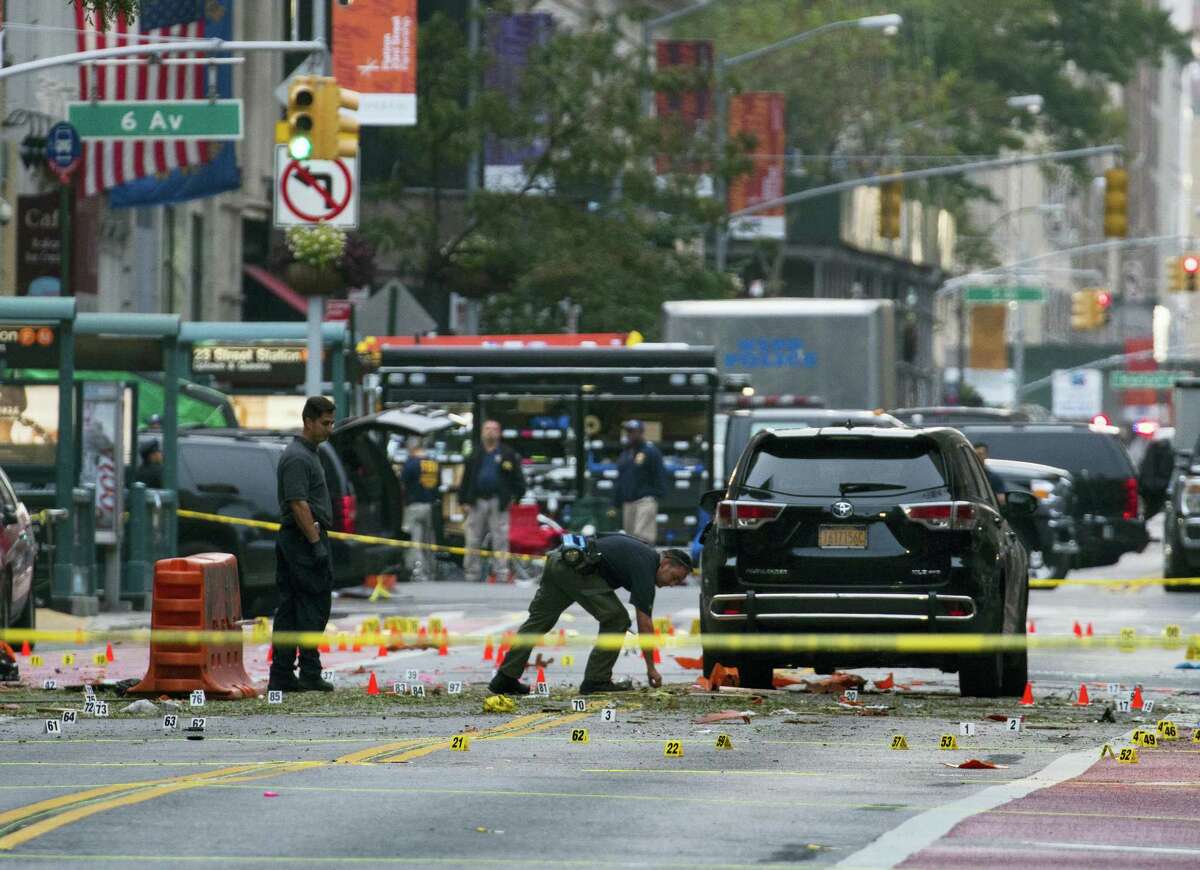 Crime scene investigators work at the scene of Saturday’s explosion in Manhattan’s Chelsea neighborhood, in New York on Sept. 18, 2016.