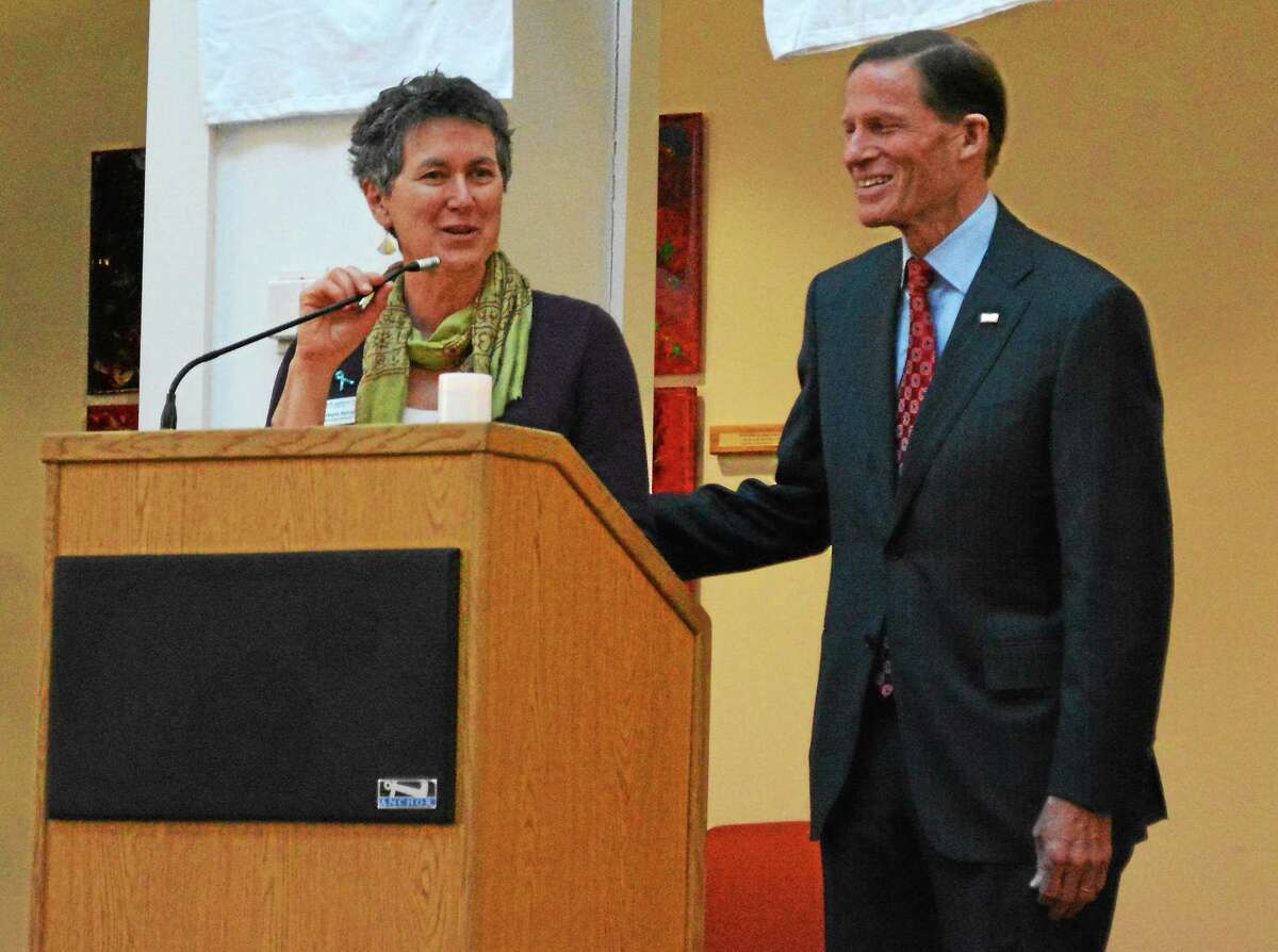 Barbara Spiegel, executive director of the Susan B. Anthony Project, has announced she will retire in June. She is seen here with U.S. Sen. Richard Blumenthal during a vigil.