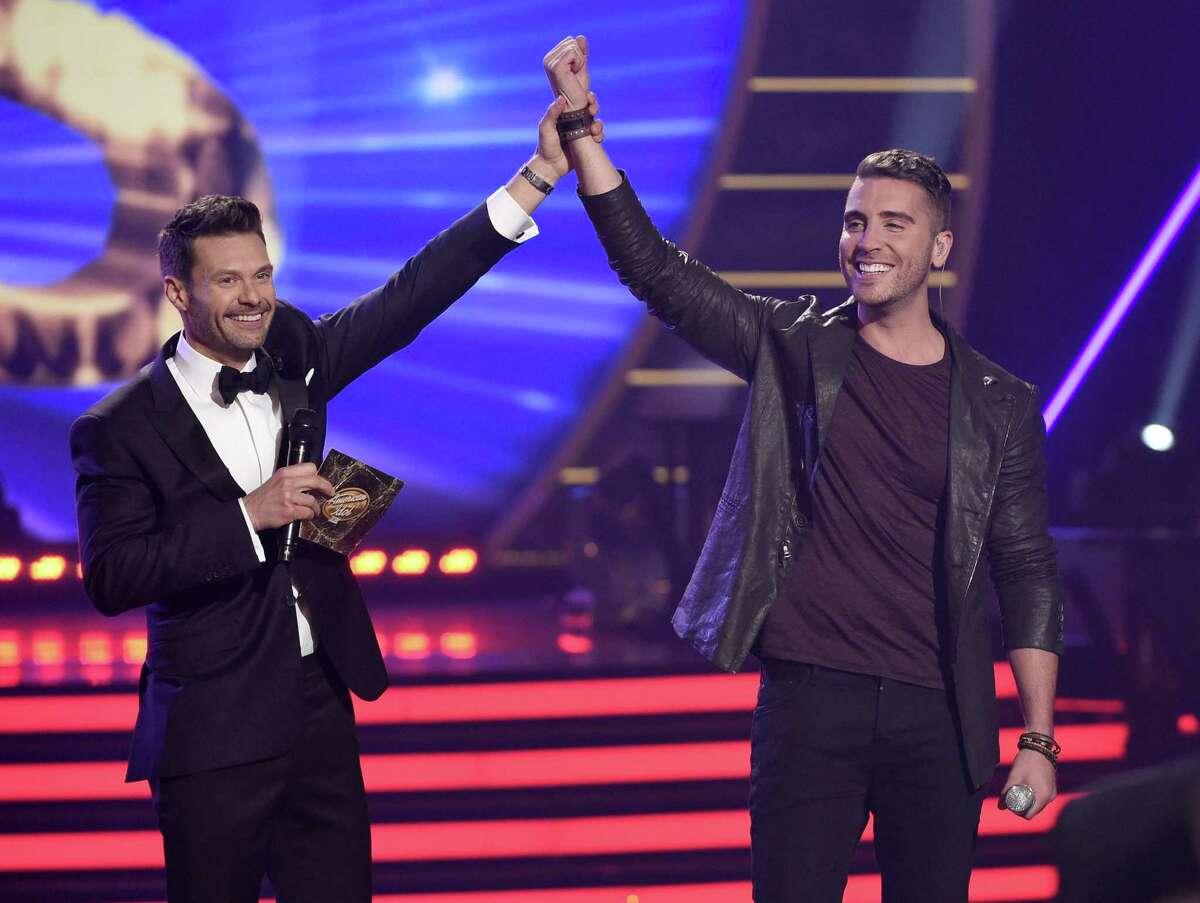 Ryan Seacrest, left, announces Nick Fradiani the winner at the American Idol XIV finale at the Dolby Theatre Wednesday in Los Angeles.