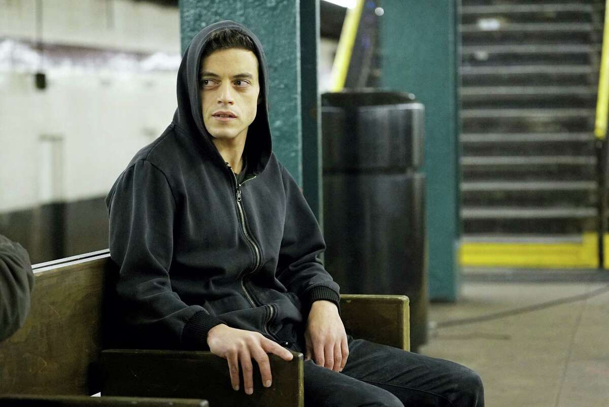In this image released by USA Network, Rami Malek appears in a scene from, “Mr. Robot.” On July 14, 2016, Malek is nominated for outstanding actor in a drama series for his role. The 68th Primetime Emmy Awards will be broadcast live Sunday on ABC beginning at 8 p.m. ET on ABC.