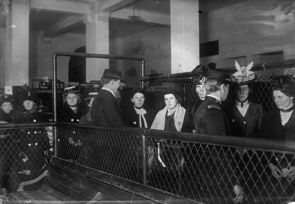 This photo made between 1907 and 1917 and made available by the Library of Congress shows immigrants at Ellis Island, New York.