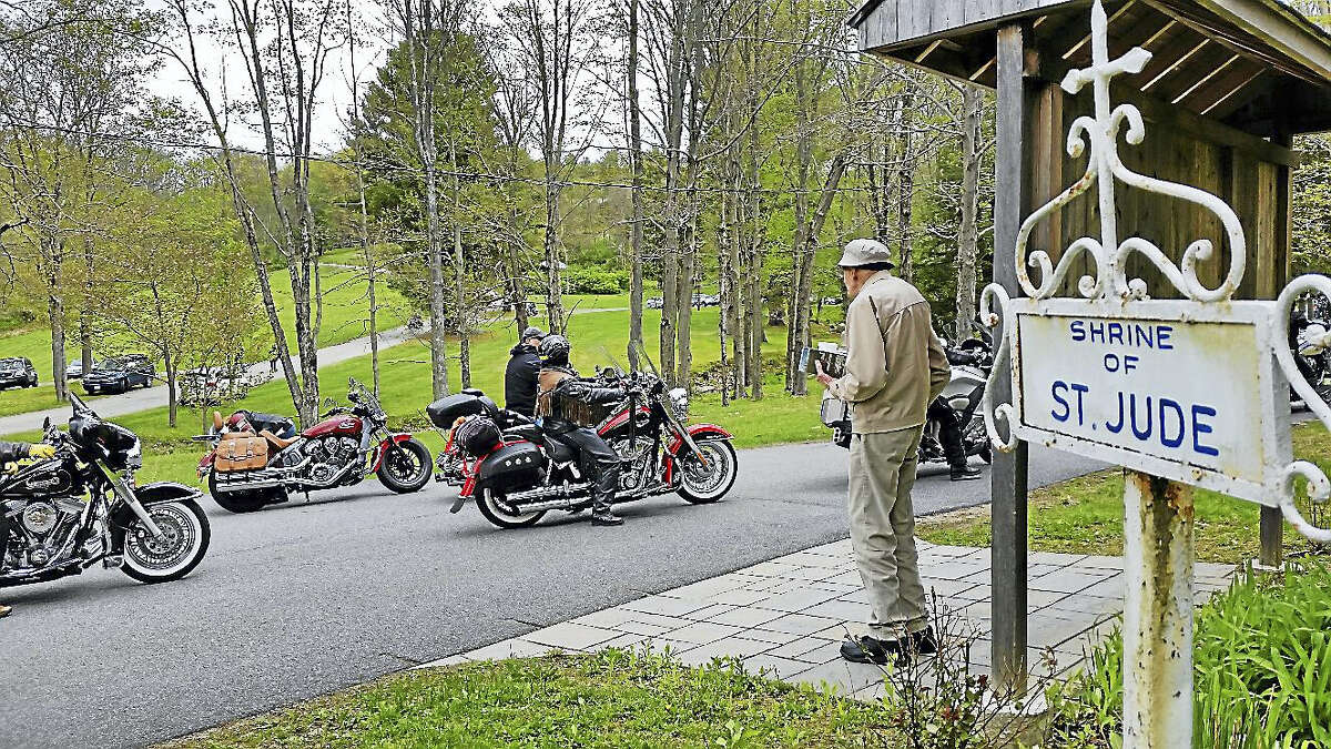 N.F. Ambery photo An onlooker watches the Annual Blessing of Motorcyclists in Litchfield.