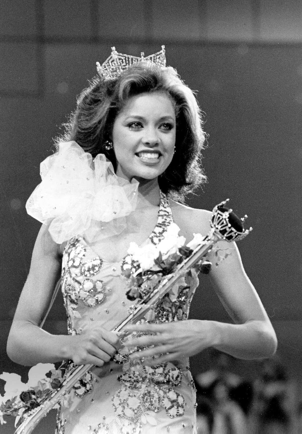 In this Sept. 17, 1983 photo, Miss New York Vanessa Williams appears during her coronation walk after she was crowned Miss America 1984 at the Miss America Pageant in Atlantic City, N.J.